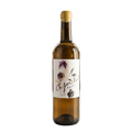 Wine bottle with a decorative label on a table in a wine cellar.