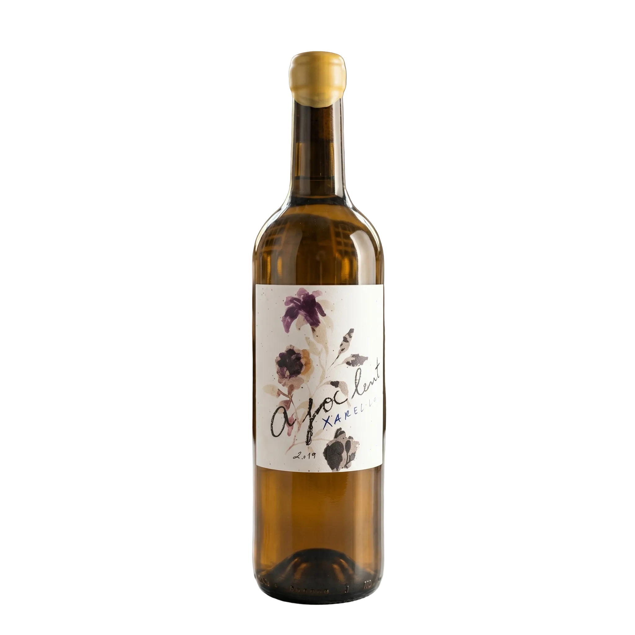 Wine bottle with a decorative label on a table in a wine cellar.