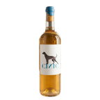 Wine bottle with a label featuring a dog silhouette in a wine cellar setting