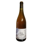 Gastine Wine bottle with 'les Cortis' label on a textured surface