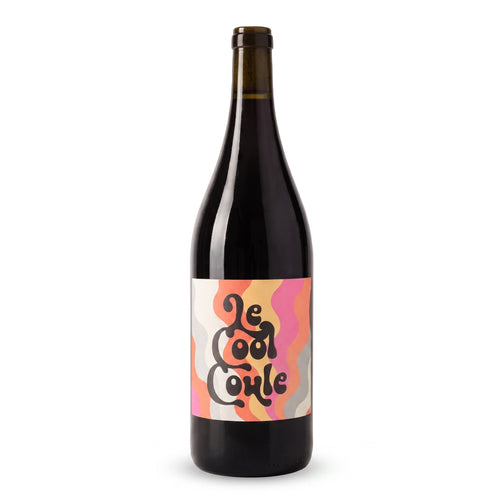 A dark glass wine bottle with a colorful retro-style label reading 'Le Cool Coule' in black script over pink, orange, yellow, and gray wavy shapes, on a clean white background.
