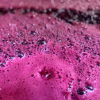 Close-up of a pinkish-purple wine with bubbles