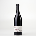 A single dark glass wine bottle with a black capsule and a white label featuring cherry blossom branches and the brand name 'reyter', photographed against a clean white background.