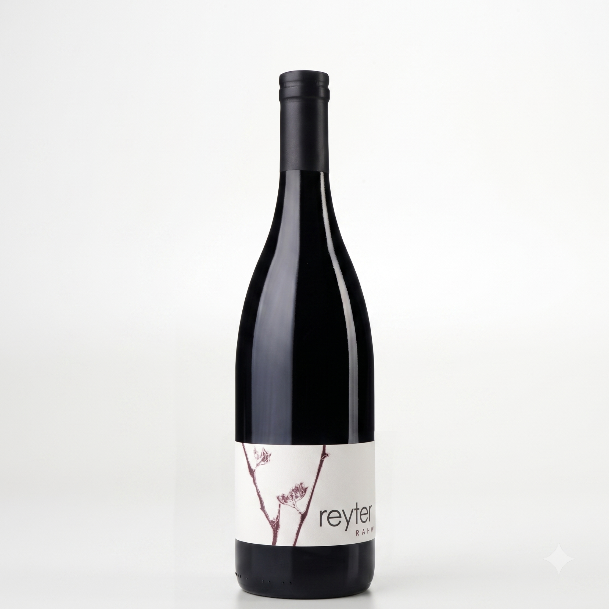 A single dark glass wine bottle with a black capsule and a white label featuring cherry blossom branches and the brand name 'reyter', photographed against a clean white background.