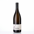 A bottle of Reyter Chardonnay non-alcoholic white wine, featuring an amber glass bottle, a black screw cap, and a minimalist white label with purple floral accents, set against a plain white background.