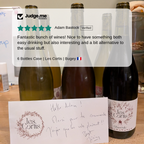 Wine bottles with labels and a handwritten card on a table, with 'Judge.me' review overlay.